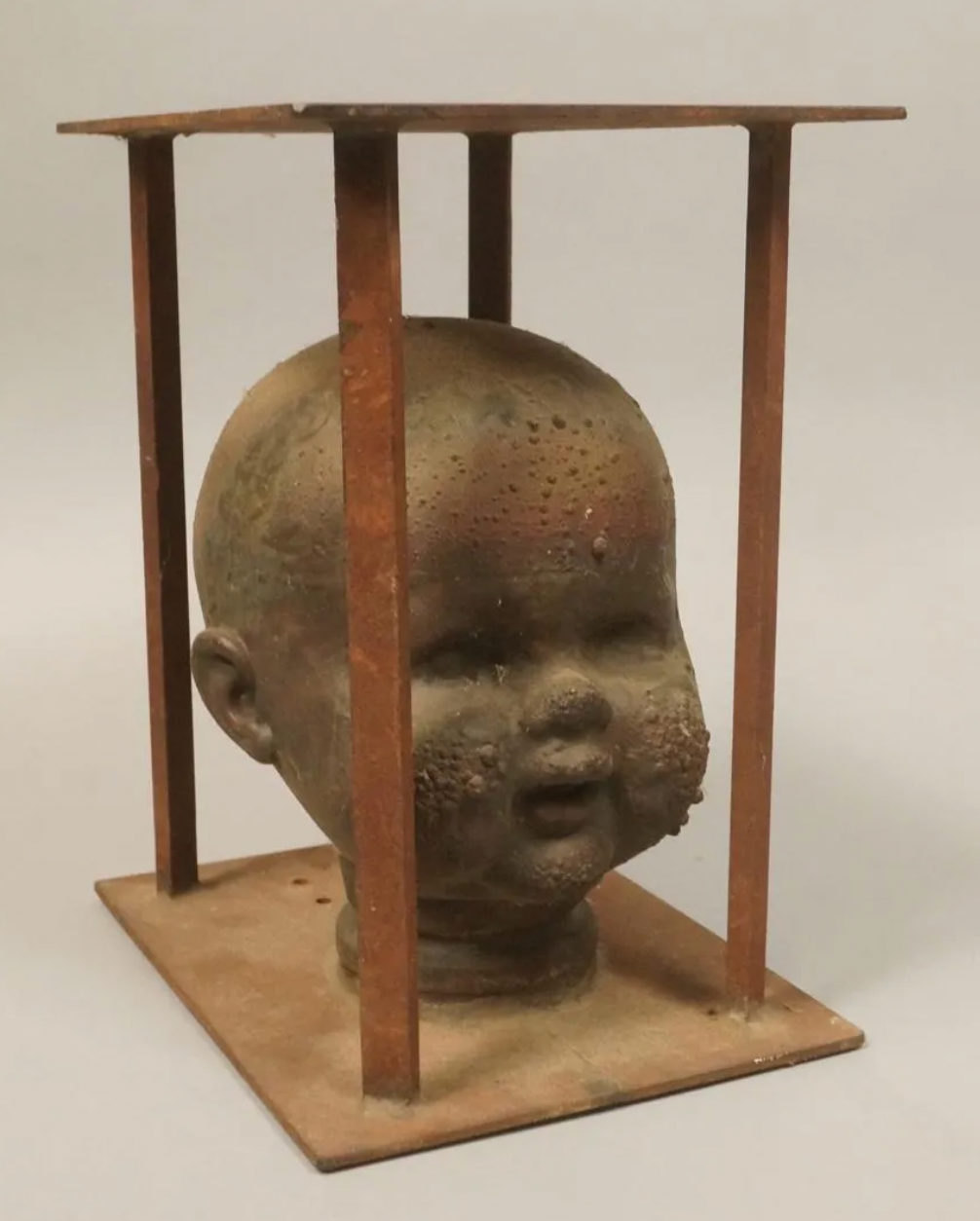 Baby doll head mold sculpture