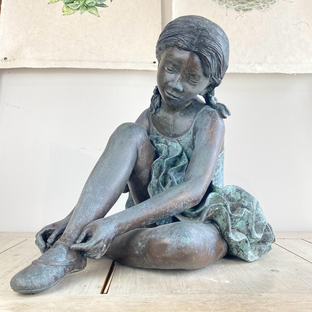 Bronze Ballerina Fixing Shoe Sculpture