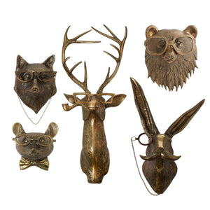 metal stag head in a brass finish smoking a pipe and wearing glasses
