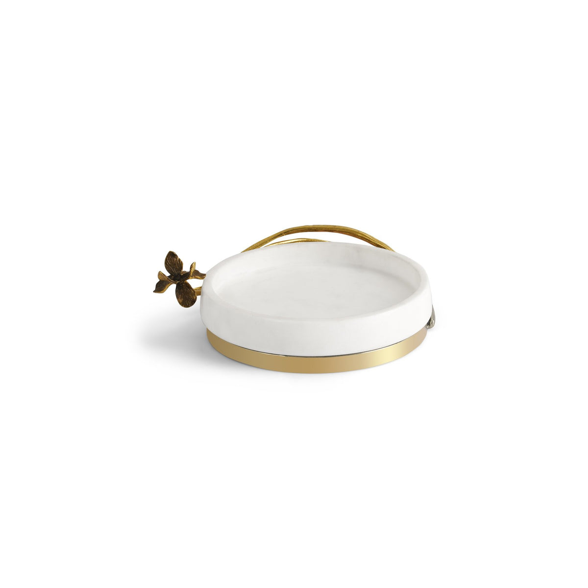 A white catch all, with a golden ring at the bottom, and a very delicate golden branch and a leaves around it