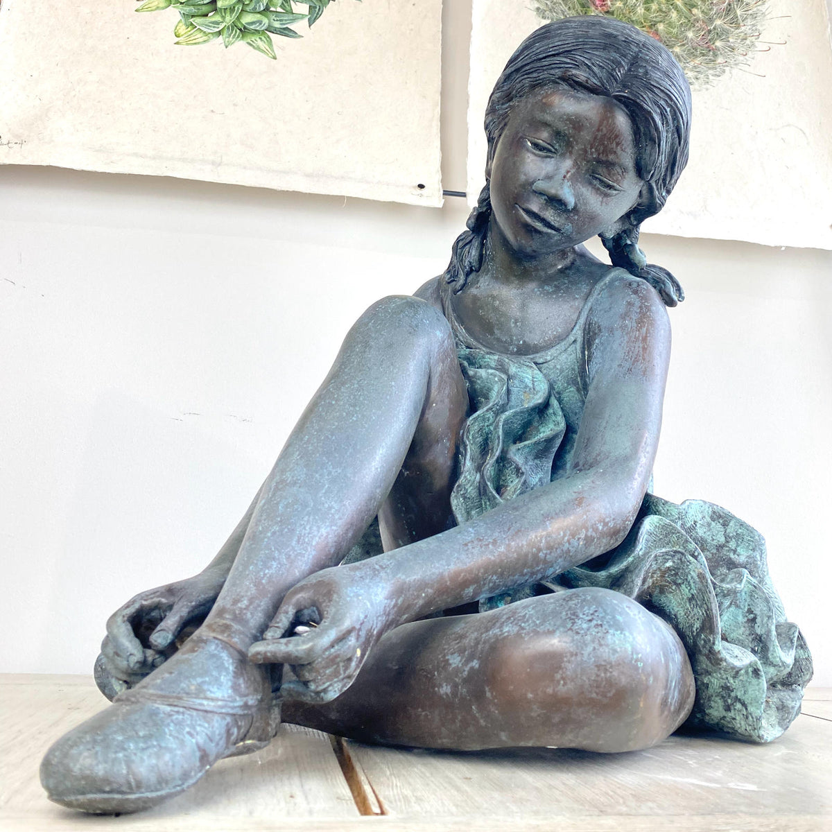 Bronze Ballerina Fixing Shoe Sculpture